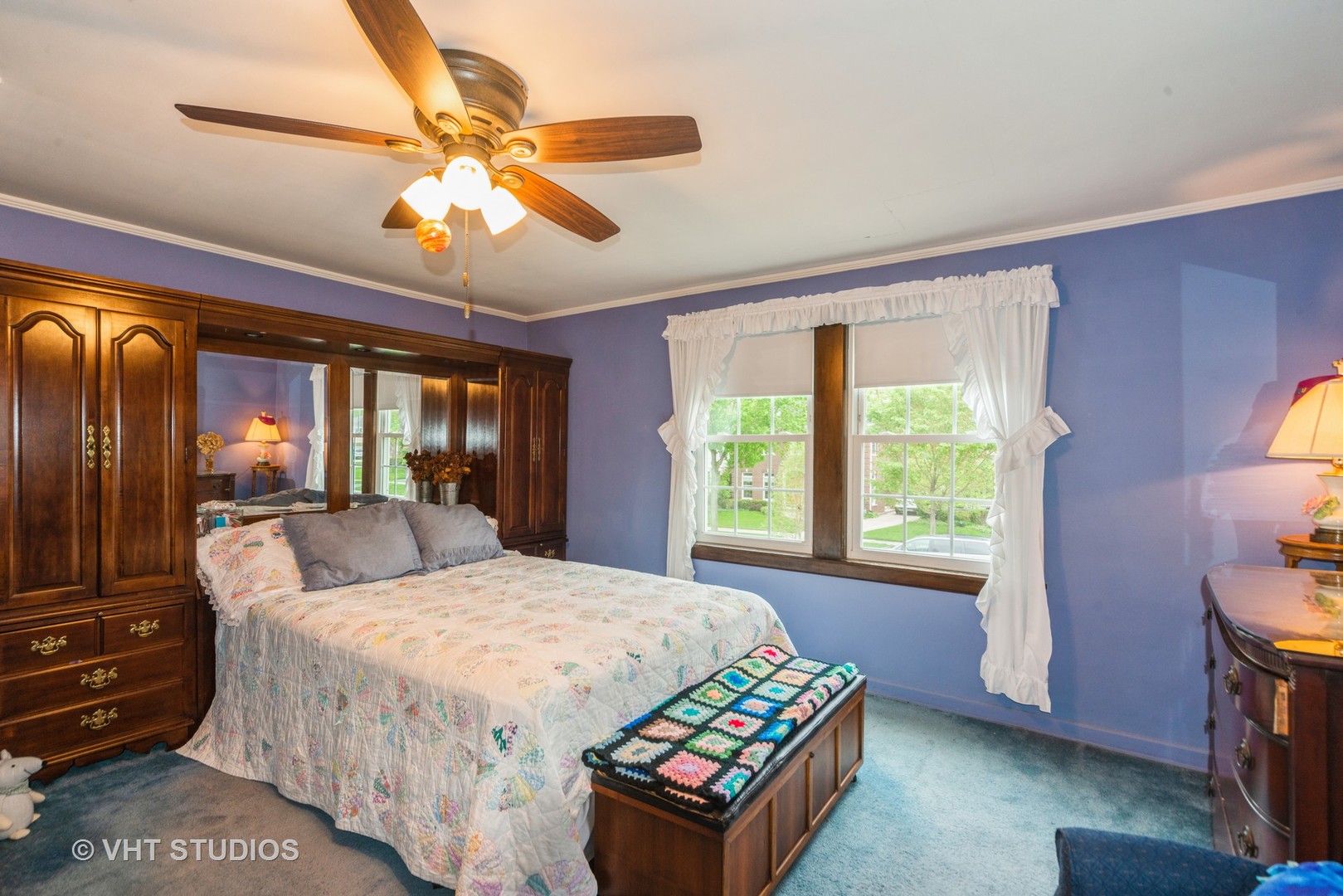 505 Warren Avenue Park Ridge, IL 60068 - Photo 10 of 21 a bedroom with a bed and a chandelier