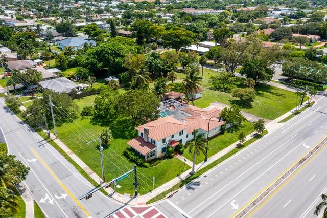 an aerial view of a residential houses with outdoor space