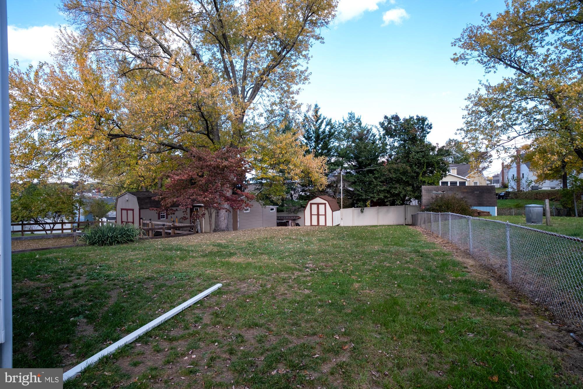 1200 Oakland Terrace Road Baltimore, MD 21227 - Photo 3 of 21 Spacious backyard with vibrant autumn hues.