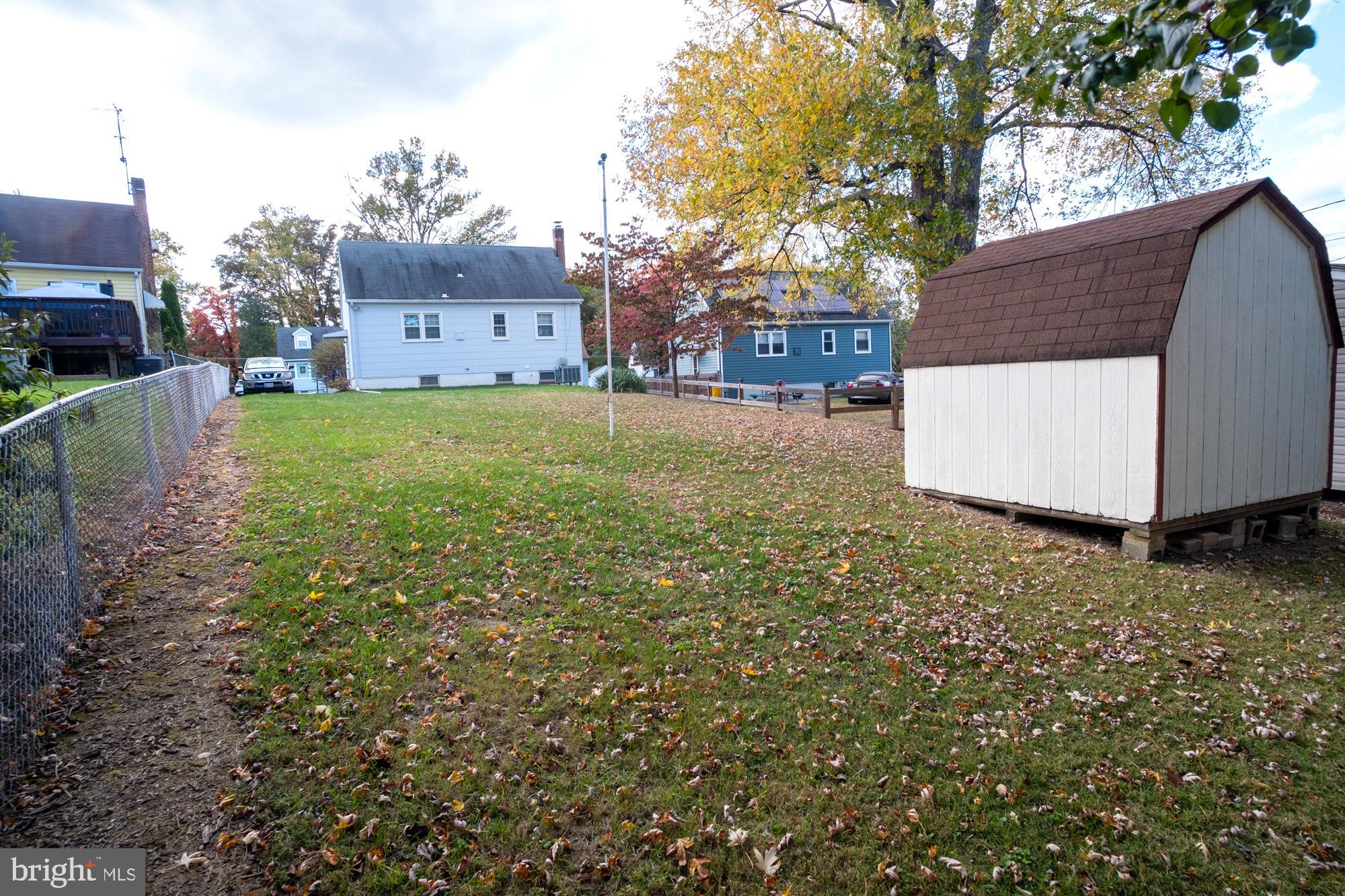 1200 Oakland Terrace Road Baltimore, MD 21227 - Photo 5 of 21 Spacious yard with seasonal foliage charm.