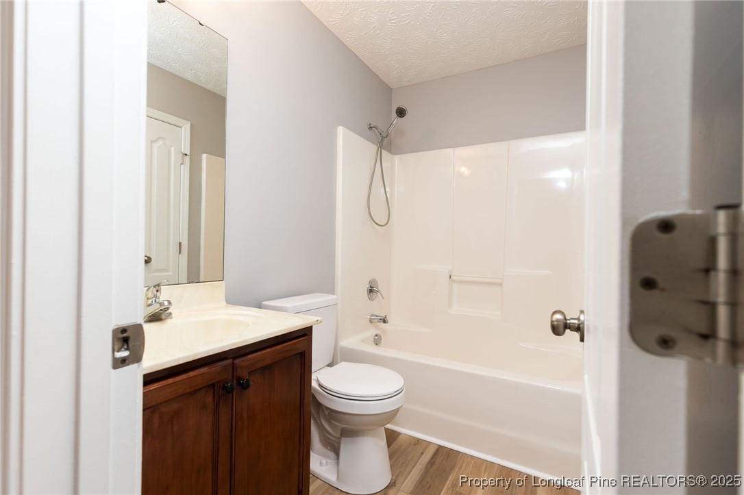 3192 Braddy Road Fayetteville, NC 28306 - Photo 13 of 20 a bathroom with a sink a toilet and shower