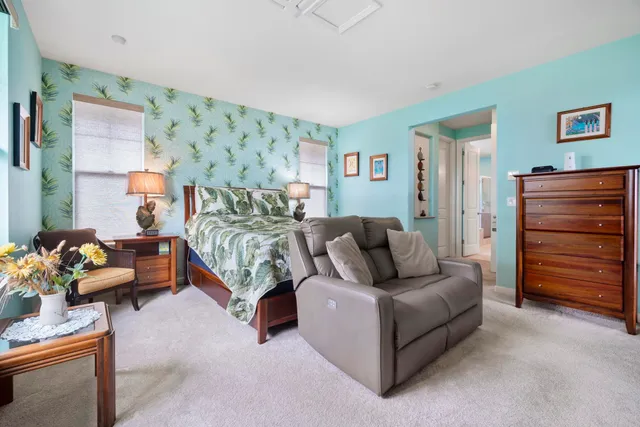 a living room with furniture and a dresser