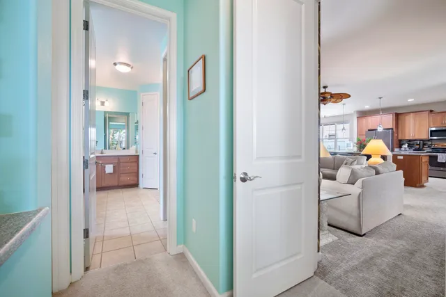 a en suite bathroom with a sink a toilet and a mirror