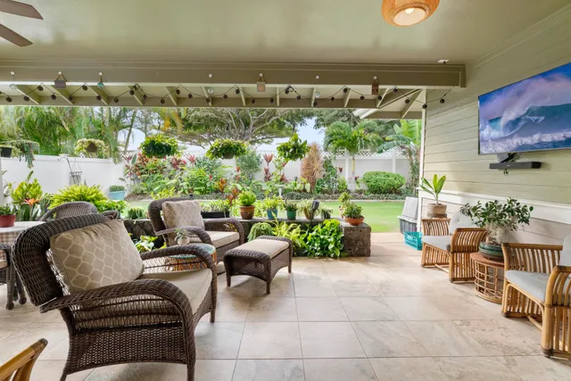 a view of a chairs and table in a patio