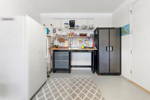 a kitchen with stainless steel appliances a refrigerator and cabinets