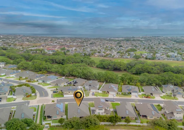 an aerial view of a house with a garden
