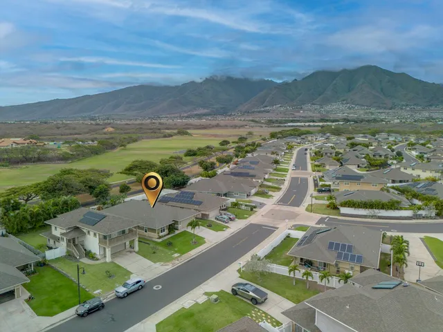 an aerial view of a house with a garden