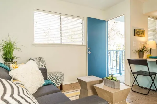 a living room with furniture and a window