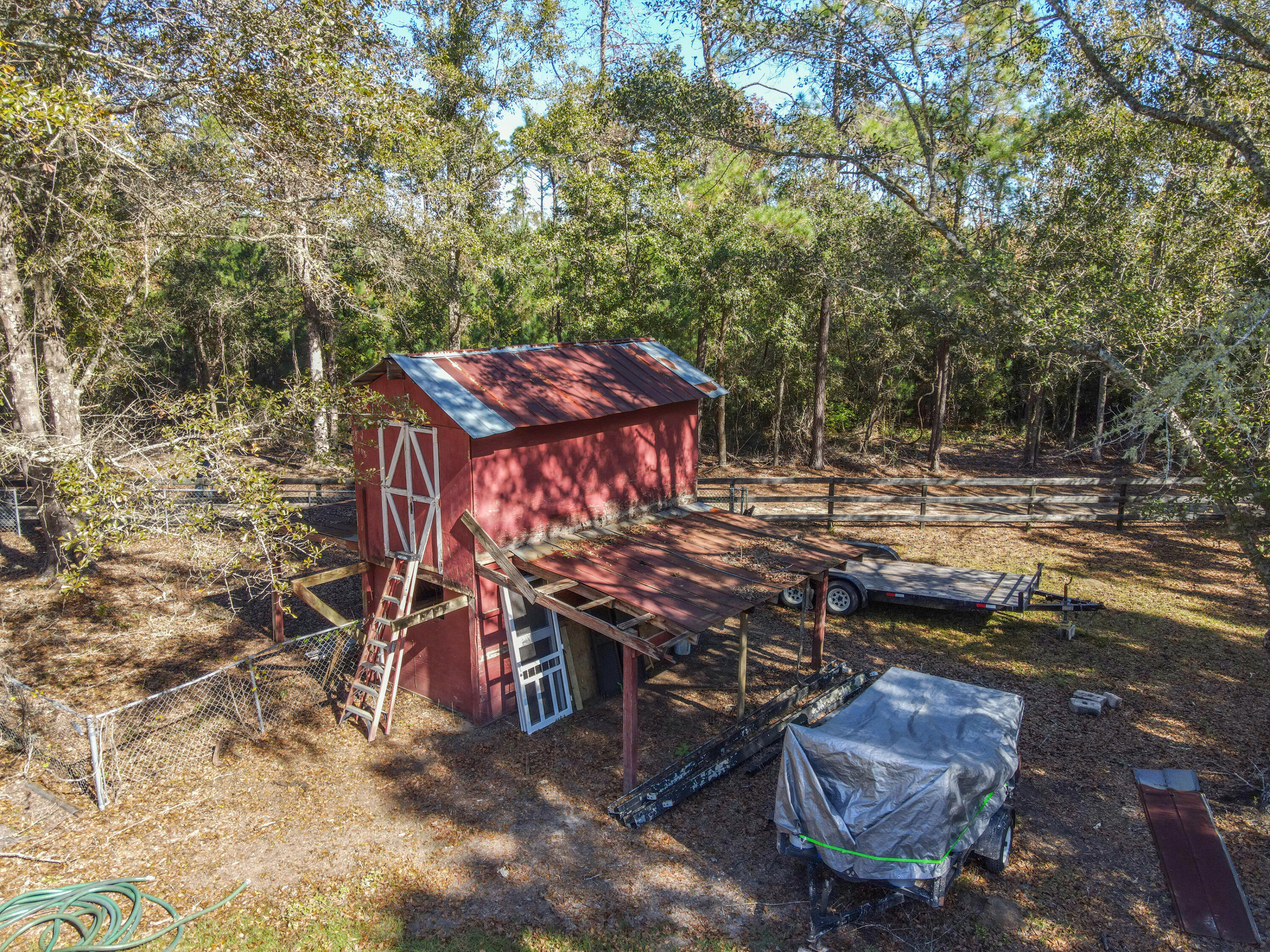 1859 Bellfield Road McClellanville, SC 29458 - Photo 50 of 59 shot of feed barn in front pasture