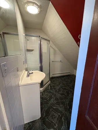 a bathroom with a sink and mirror