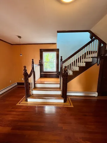 a view of entryway with wooden floor