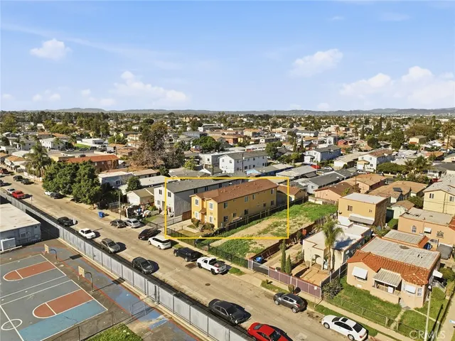 an aerial view of residential building with parking space