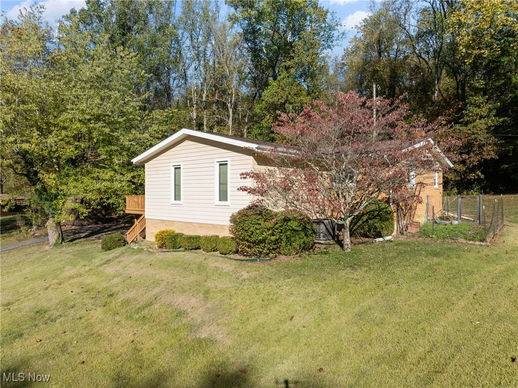 59638 Broadview Road Shadyside, OH 43947 - Photo 3 of 43 View of home's exterior featuring a yard and a deck