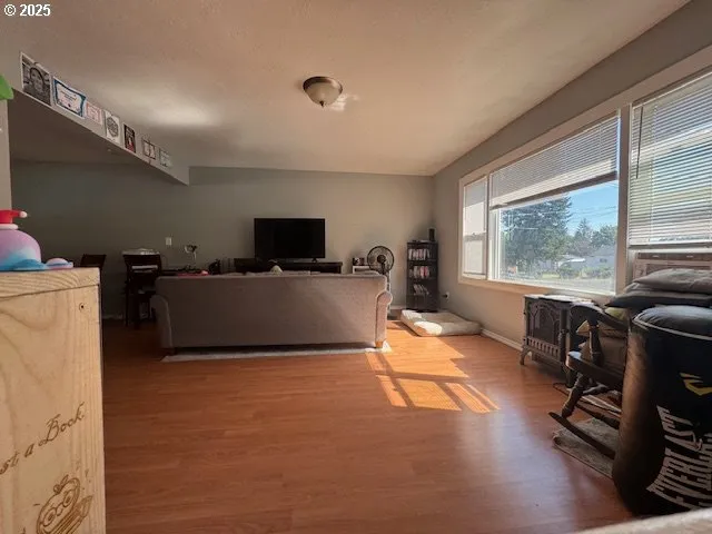 a view of a livingroom with furniture and a window