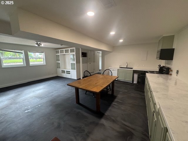 911 Division La Grande, OR 97850 - Photo 16 of 39 an empty room with wooden floor and windows