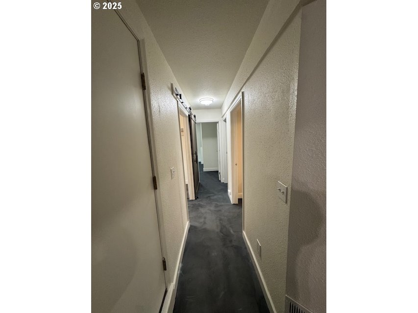 911 Division La Grande, OR 97850 - Photo 20 of 39 a view of a hallway with a large mirror