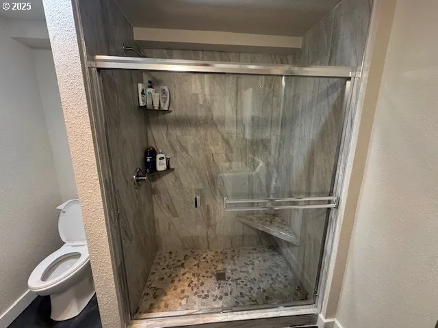 a bathroom with a sink toilet and mirror