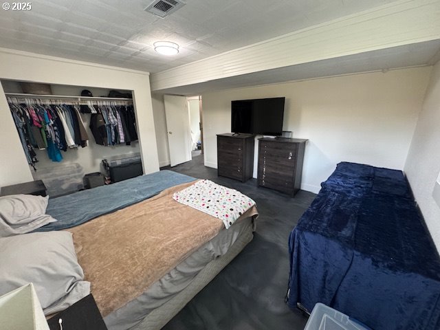 911 Division La Grande, OR 97850 - Photo 23 of 39 a bedroom with bed and walk in closet