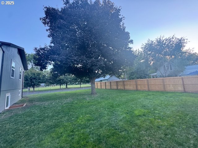 911 Division La Grande, OR 97850 - Photo 31 of 39 a view of a yard with a fence and trees
