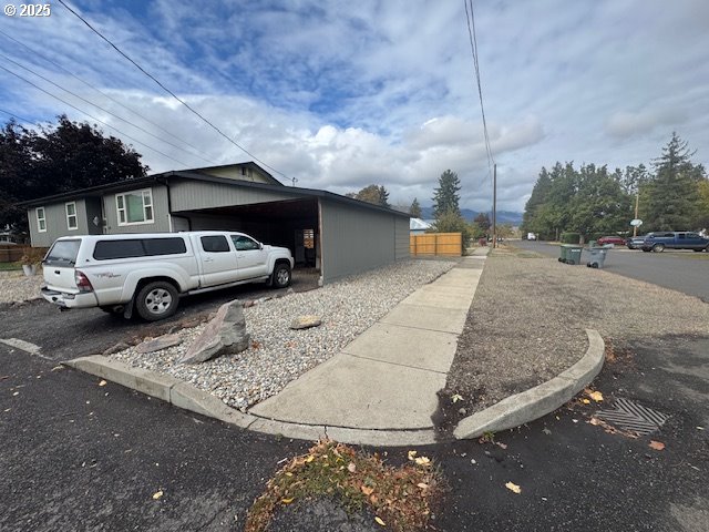 911 Division La Grande, OR 97850 - Photo 34 of 39 a car parked in parking area of a house