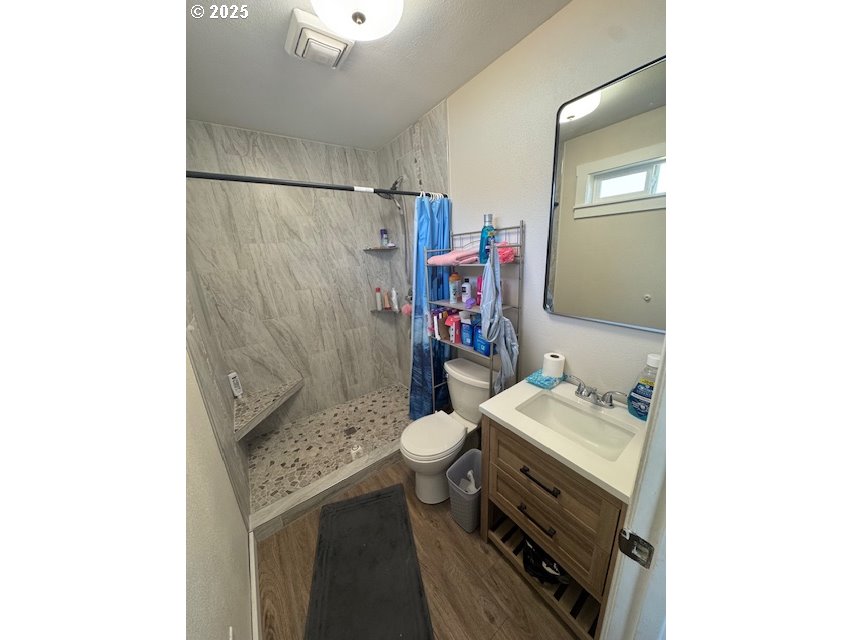 911 Division La Grande, OR 97850 - Photo 7 of 39 a bathroom with a sink toilet and shower