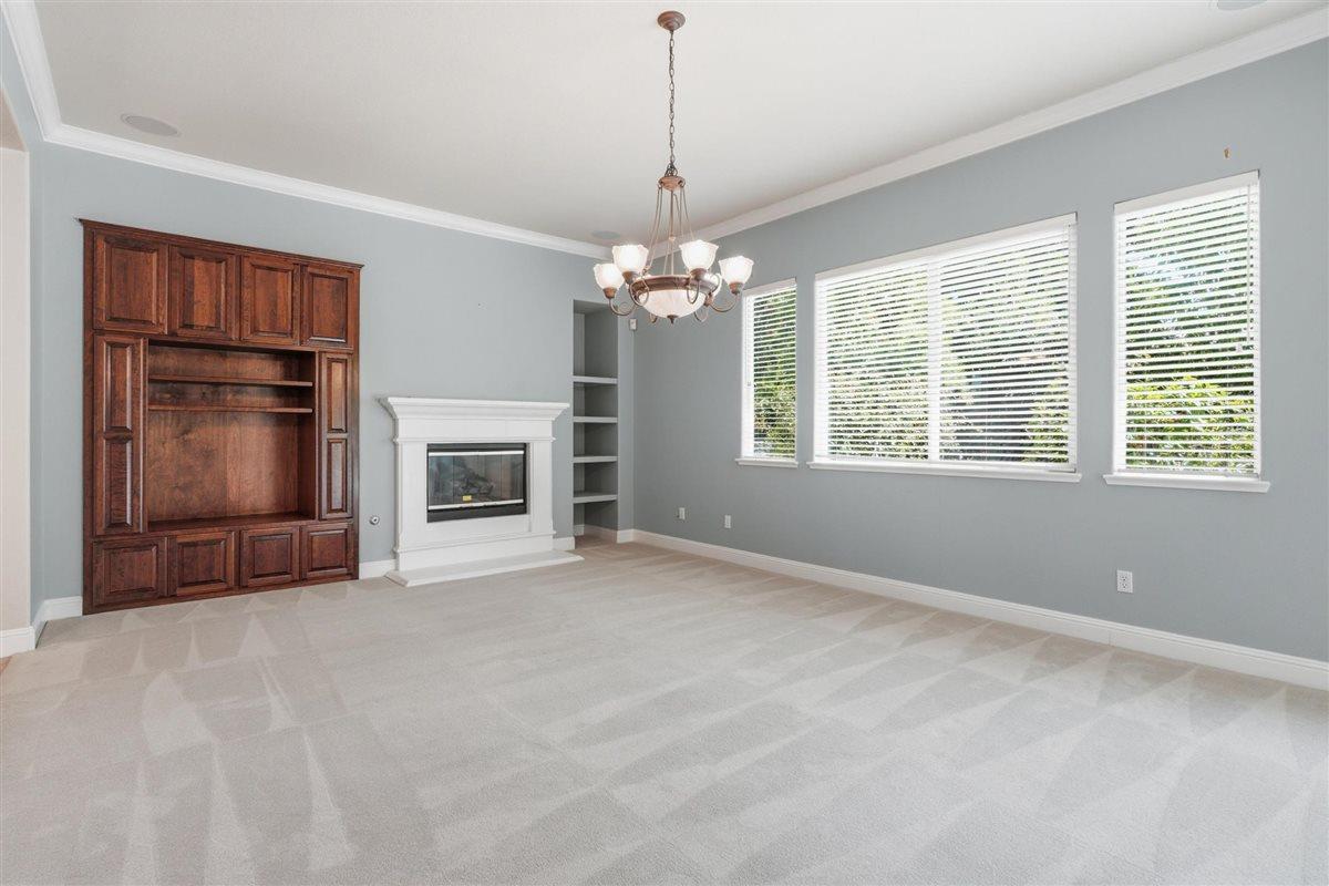 4129 Poppleton Way Carmichael, CA 95608 - Photo 20 of 48 a view of an empty room with a window and fireplace