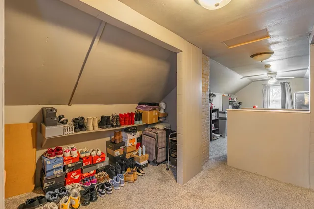 an outdoor sitting area with couch and chairs