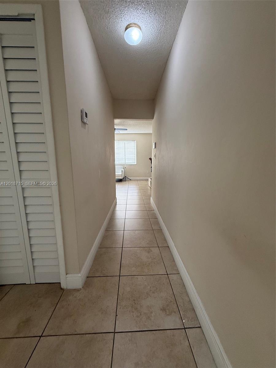 6720 Southwest 21st Street, Unit 1 Miami, FL 33155 - Photo 14 of 26 a view of a hallway