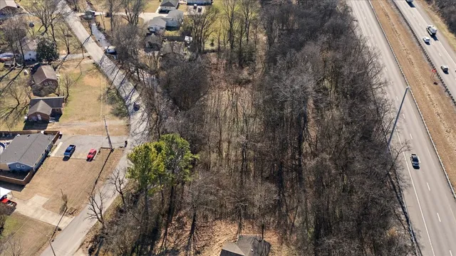 a view of a backyard of the house