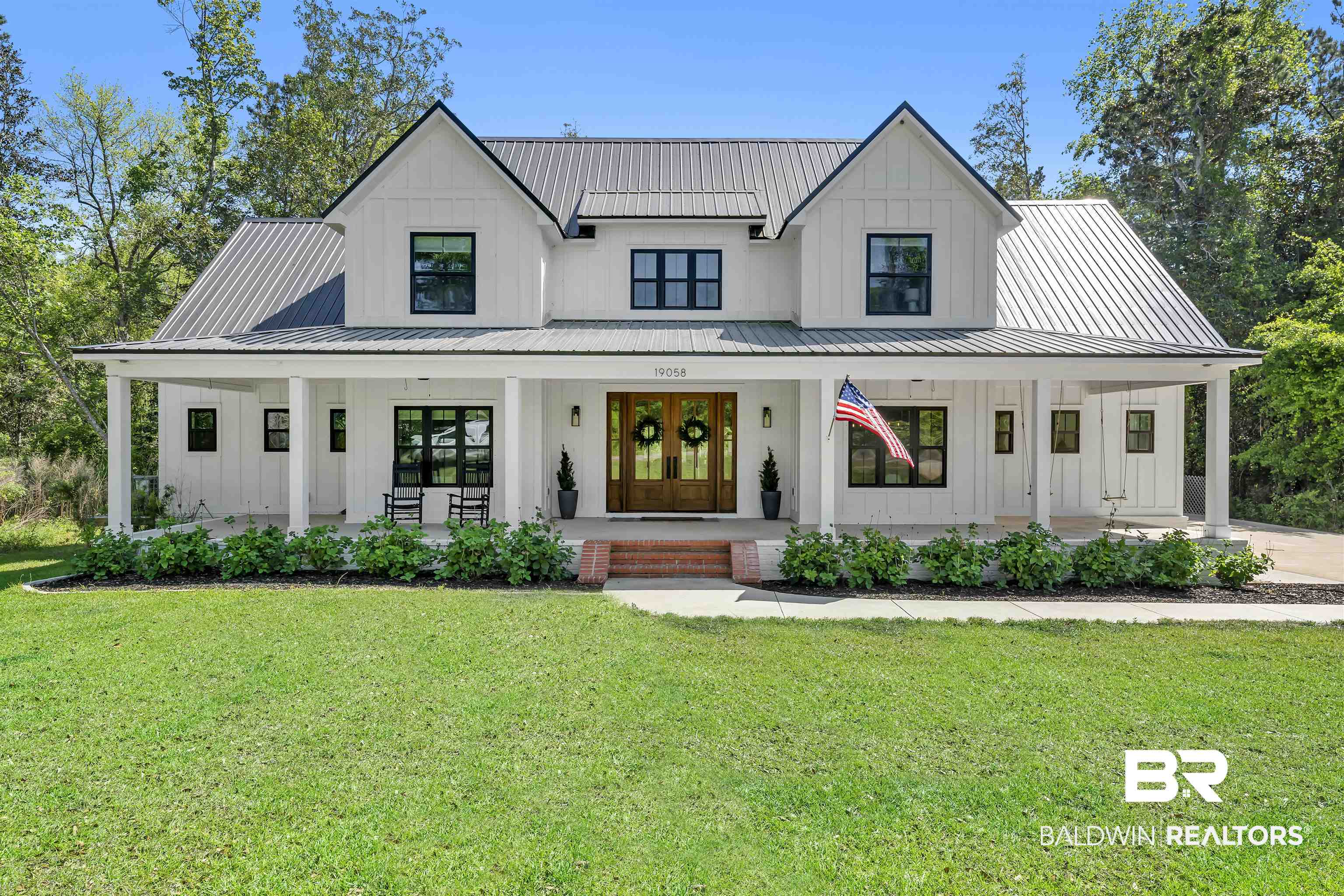 19058 James Road Gulf Shores, AL 36542 - Photo 1 of 49 Modern inspired farmhouse featuring board and batten siding and covered porch