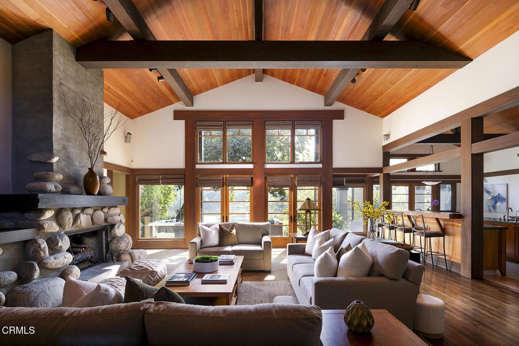 1260 La Loma Road Pasadena, CA 91105 - Photo 12 of 61 a living room with furniture a fireplace and a floor to ceiling window