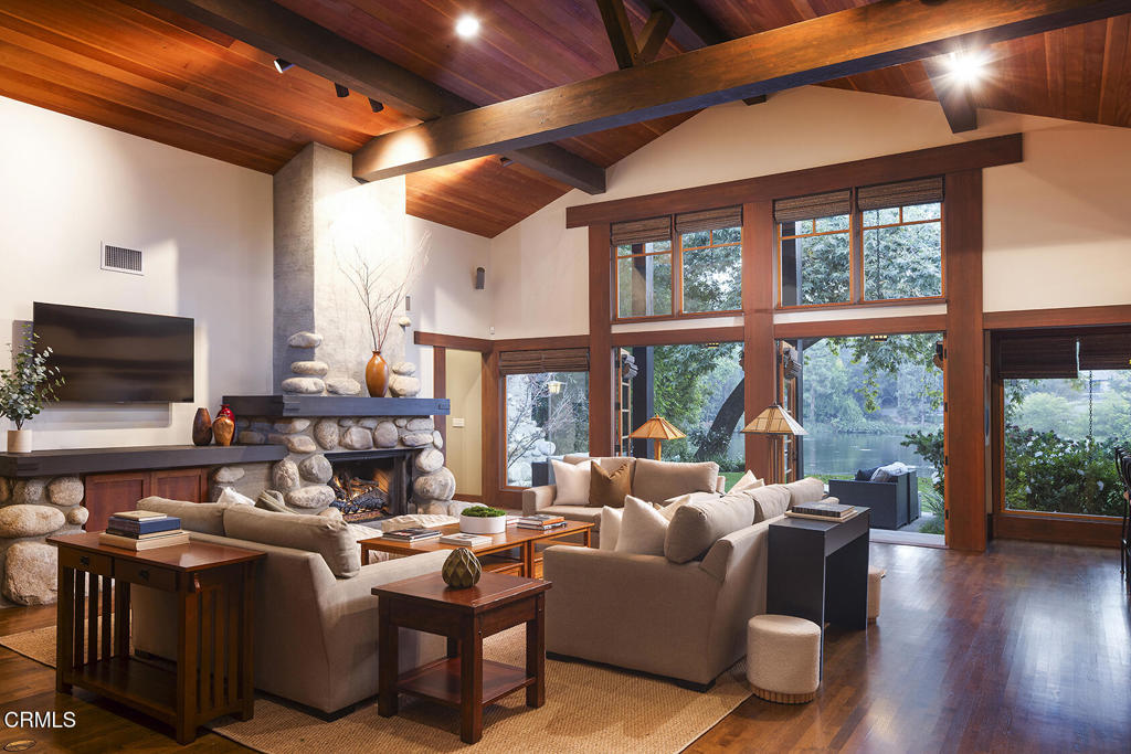 1260 La Loma Road Pasadena, CA 91105 - Photo 18 of 61 a living room with furniture a large window and a flat screen tv