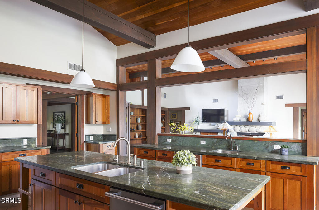 1260 La Loma Road Pasadena, CA 91105 - Photo 28 of 61 a kitchen with stainless steel appliances granite countertop a sink a stove and a wooden cabinets