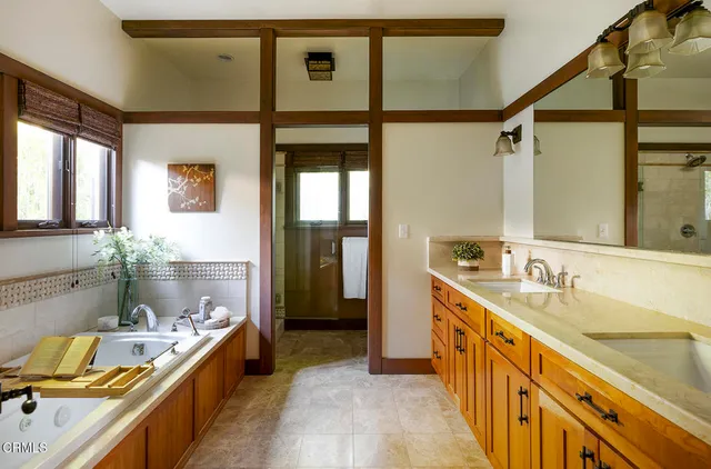 a view of a house with swimming pool and sitting area
