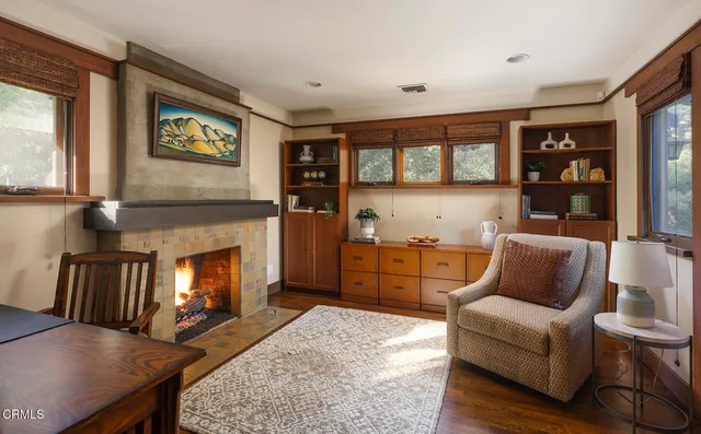 a view of a white house with a big yard and large trees