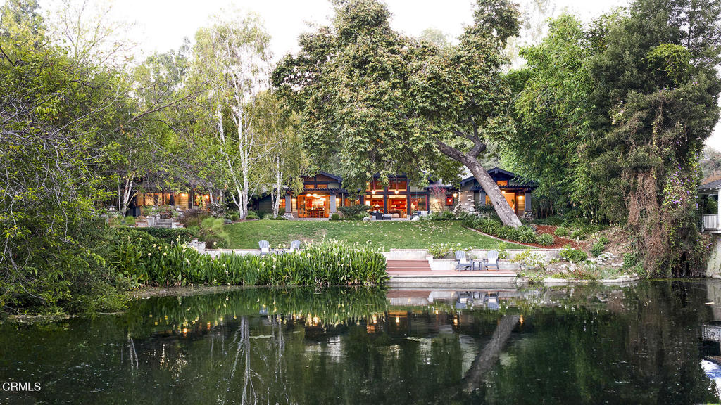 1260 La Loma Road Pasadena, CA 91105 - Photo 50 of 61 a backyard of a house with lots of green space and lake view