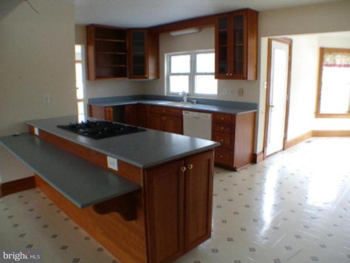 3738 Rittenour Road Woodstock, VA 22664 - Photo 3 of 30 a kitchen with a sink a window and cabinets