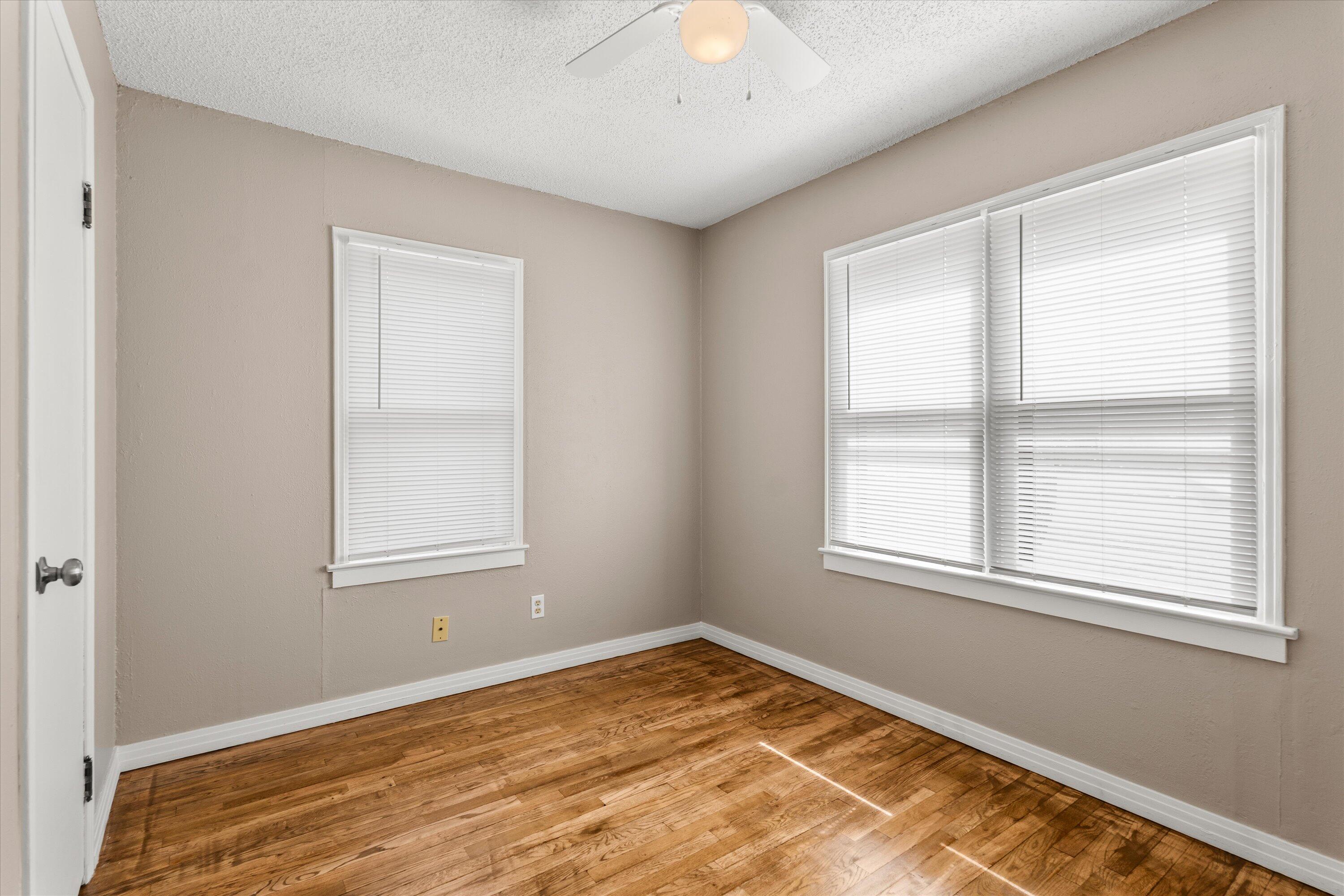 107 Hickory Street Levelland, TX 79336 - Photo 16 of 21 an empty room with a window