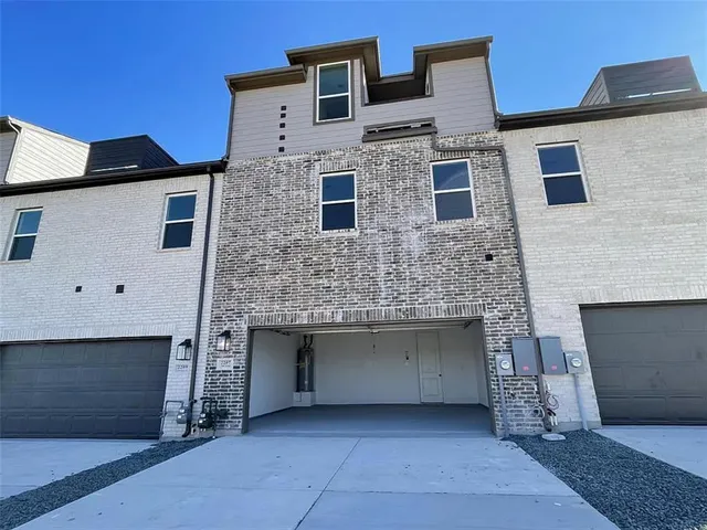 a front view of a house with yard
