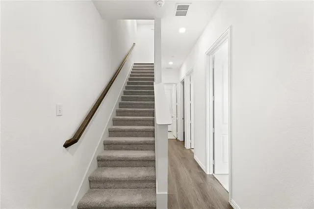 a view of a hallway with staircase