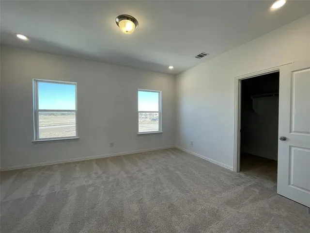 an empty room with windows