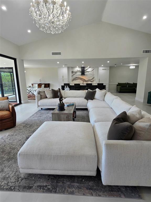 10486 Boca Woods Lane Boca Raton, FL 33428 - Photo 2 of 18 a living room with furniture and a large window