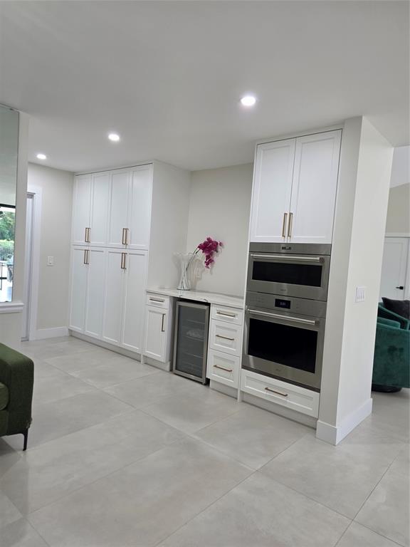 10486 Boca Woods Lane Boca Raton, FL 33428 - Photo 5 of 18 a view of a kitchen with refrigerator and window