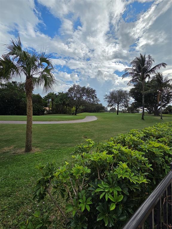 10486 Boca Woods Lane Boca Raton, FL 33428 - Photo 10 of 18 a view of a golf course with a garden