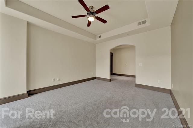 4300 Sharon Road, Unit 544 Charlotte, NC 28211 - Photo 9 of 10 a view of a livingroom with a ceiling fan and window