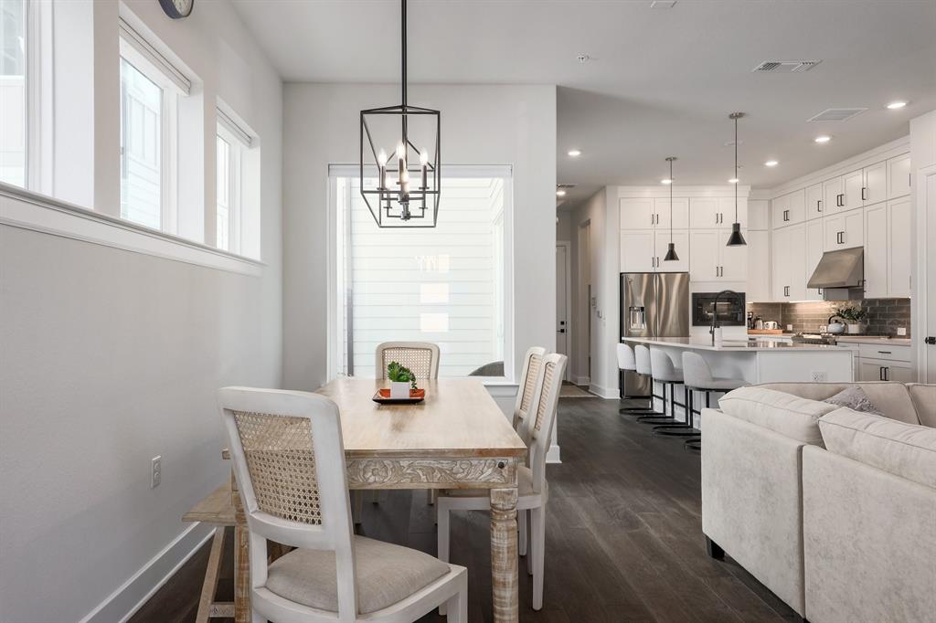 3907 Tilley Street Austin, TX 78723 - Photo 9 of 26 a view of a dining room with furniture and wooden floor