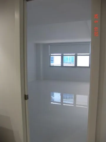 a view of an empty room and window