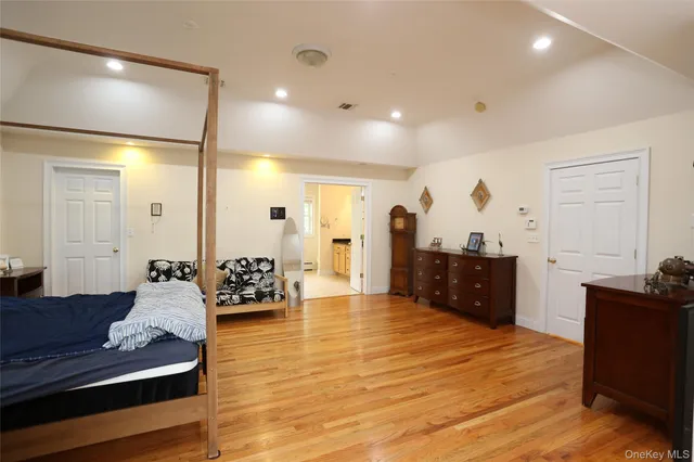 a large room with furniture and wooden floor