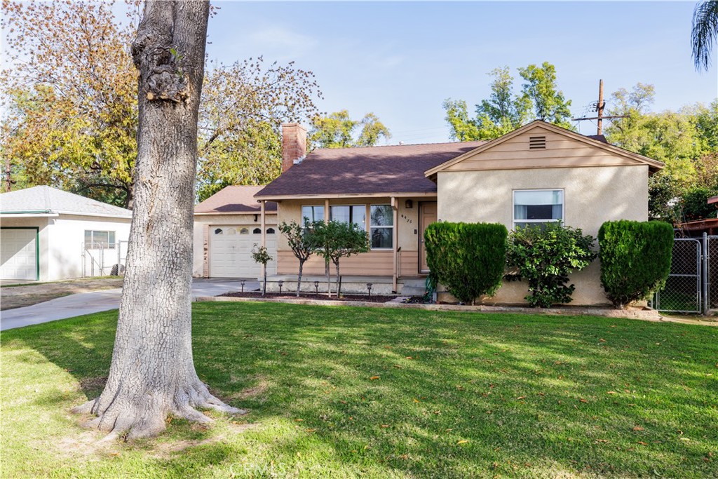 4476 Michael Street Riverside, CA 92507 - Photo 1 of 1 a front view of a house with garden