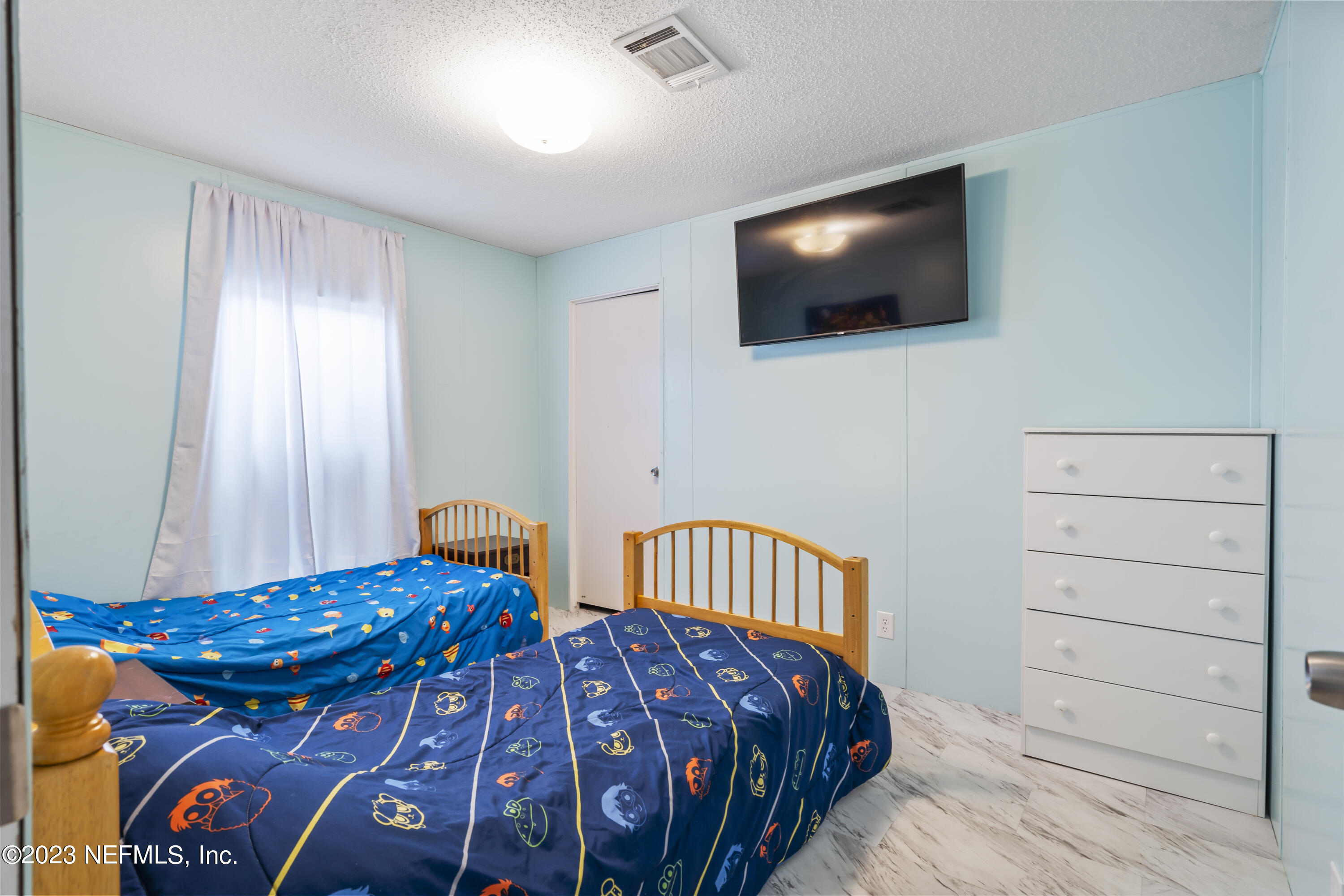 198 Yellow Water Road Baldwin, FL 32234 - Photo 19 of 37 a bedroom with two beds and a flat screen tv